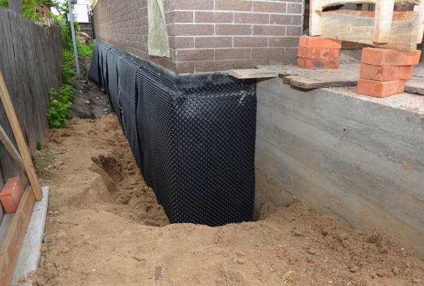 Happy homeowners after waterproofing job in Westbury
